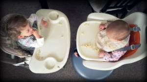 Kids in highchairs, an aerial view.