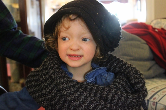 Fiona smiling in a black winter hat and thick gray scarf.